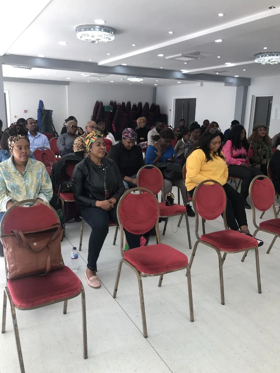Members of a church congregation seated in the P2 Centre hall in Erith