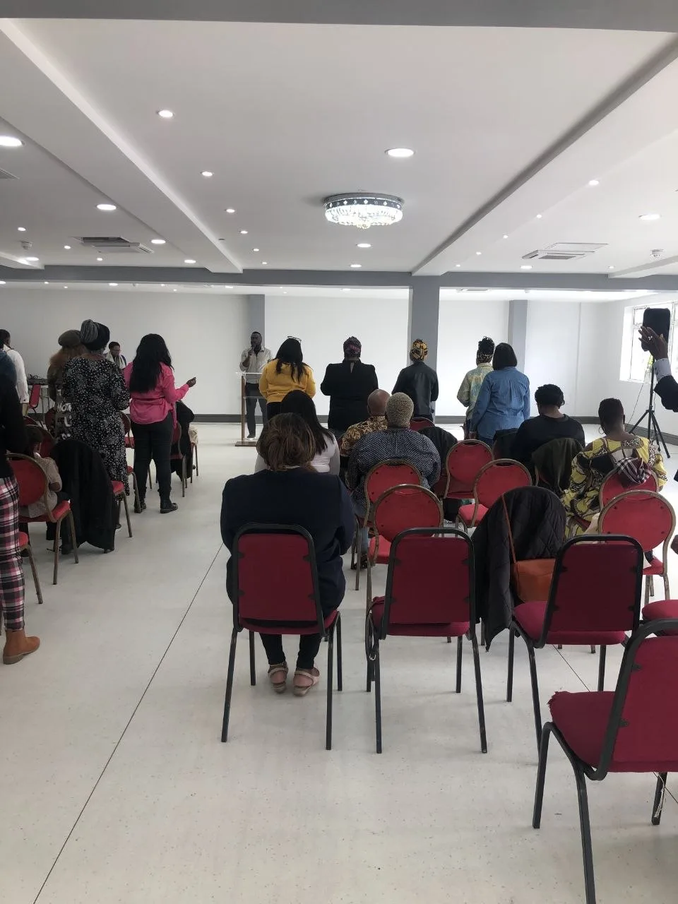 Pastor leading a Sunday church service at the P2 Centre hall, Erith