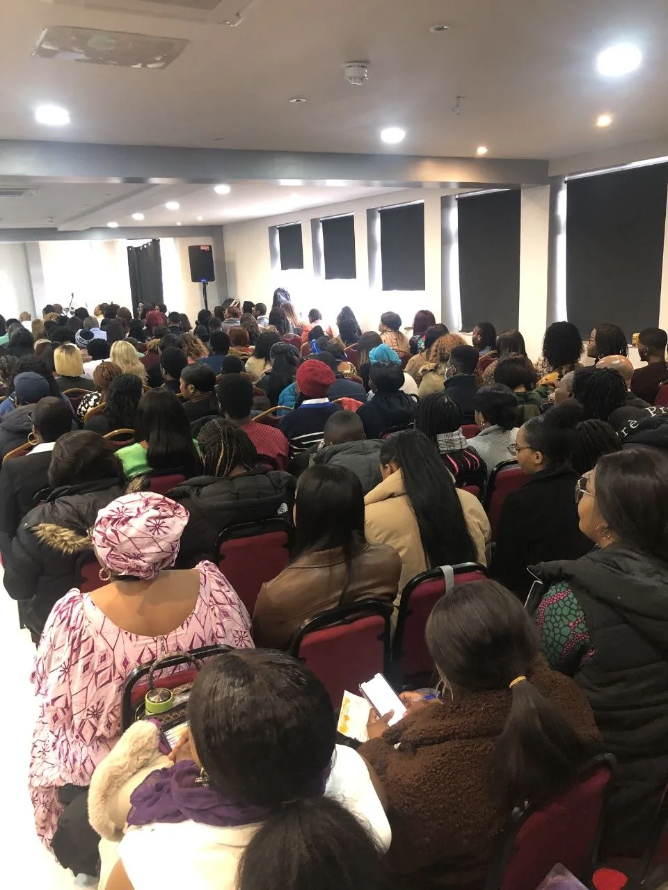 Conference in Erith with a full audience seated in rows at P2 Centre