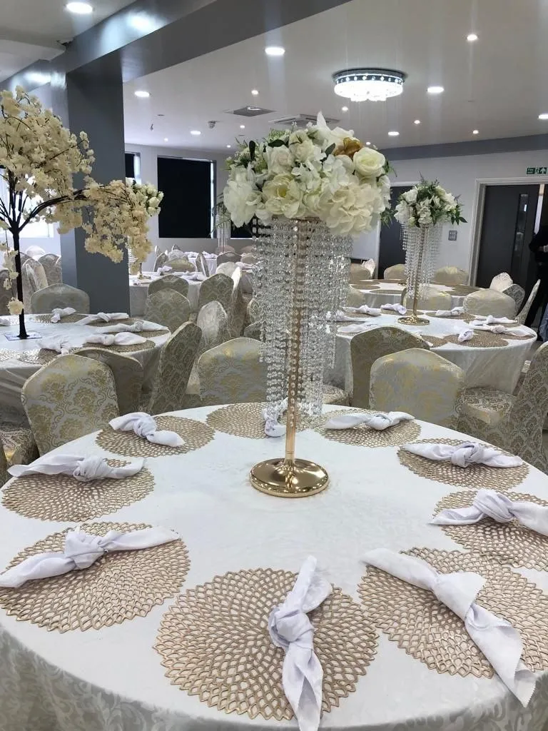 White and gold table setting with crystal floral centrepieces in the P2 Centre hall, Erith